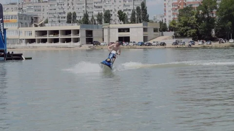 A young guy is riding a hydrocycle on the river Stock Footage 90635520