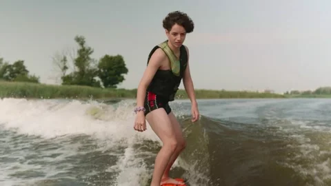 Young guy riding wake surfing Stock Footage 158793075