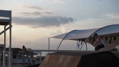 Young guy is rollerblading and performing tricks Video stock 102781037