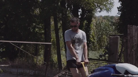 Young guy rolls on a trailer hydrocycle 動画素材 90632365