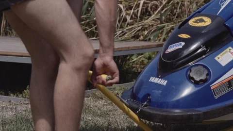 Young guy rolls on a trailer hydrocycle Stock Footage 90632992