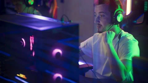 Young Guy Roots For His Team While Playing PC Video Game And Enjoys Gaming Hobby Stock Footage 169168235