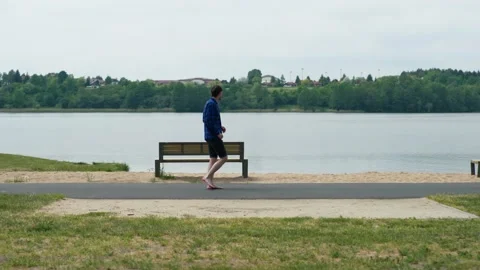 Young guy running on the beach Stock Footage 196148613