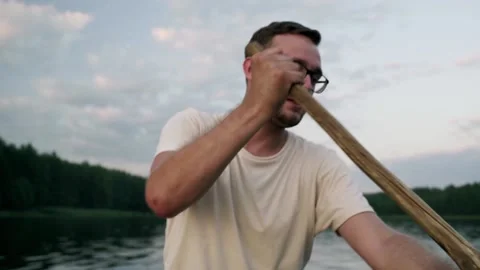 A young guy sailing on a boat Stockbeeldmateriaal 157557587