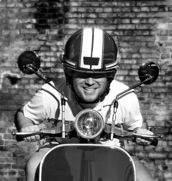 Young guy on a scooter Stock-Fotos
