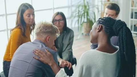 A Young Guy Shares his Problems at a Session of a Psychological Therapy Group. Stock Footage 166842309
