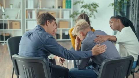 A Young Guy Shares his Problems at a Session of a Psychological Therapy Group. Stock Footage 166842509