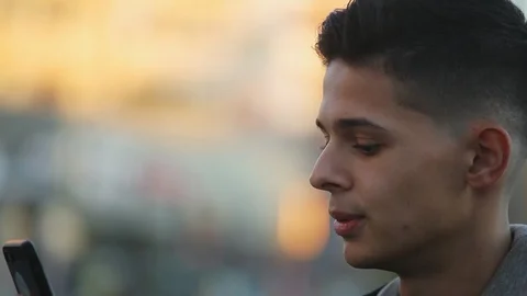 Young guy shooting video message for his friend outdoors Video stock 97409265