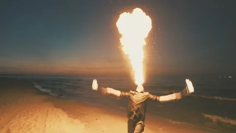 Young guy shows fire show on the beach. Stock Footage 91710318