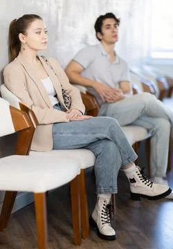 Young guy sitting in a queue at a modern office Stock Photos