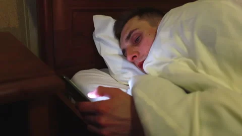 Young guy sitting on social networks before bed. Stock Footage 167270385