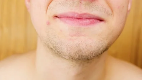 Young guy is smiling directly at the camera.Close-up lips guy smile.Happy male. Stock Footage 201915068