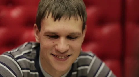 Young Guy Smiling in a Restaurant Video stock 34229531