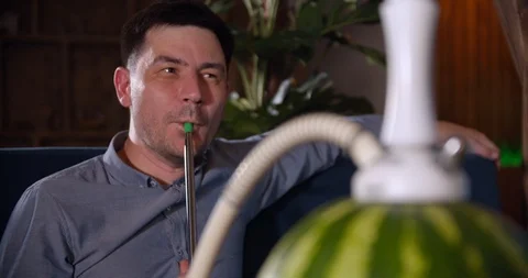 Young guy smoking hookah Stock Footage 112949453