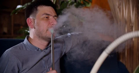 Young guy smoking hookah Video stock 112949467