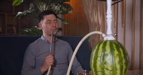 Young guy smoking hookah Stock Footage 112949482