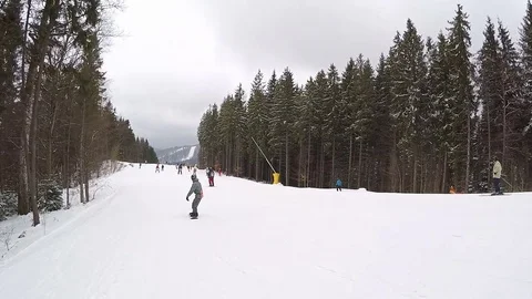 Young guy is snowboarding. Stock Footage 74700364