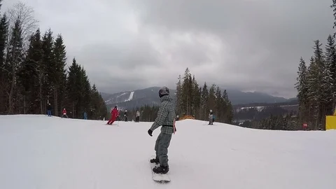 Young guy is snowboarding. Stock Footage 74701069