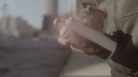 Young guy spray the camera Vídeos de archivo 93727428