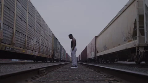 Young Guy Stands Deep In Thought On Train Tracks Stock Footage 270326960