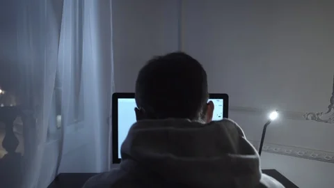 Young guy struggling with script writing on computer at night in room Stock Footage 85706585