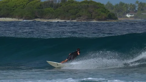 Young guy surfs in the ocean Stock Footage 300425510