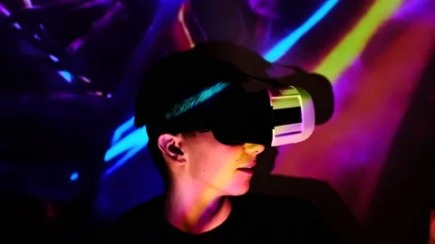 Young guy is surprised, waving hands in front of a large display. Man looks and  Stock Footage 130176293