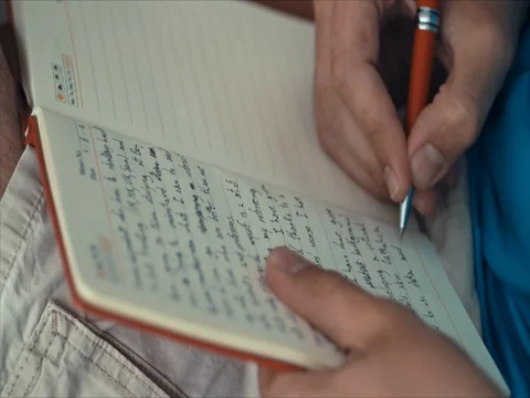 Young guy taking notes at class Stockbeeldmateriaal 81531938