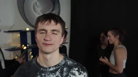 Young guy talk to the camera while his friends making selfie Stock Footage 156238808