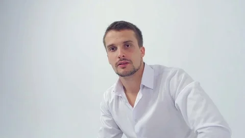 A young guy talks calmly and then get angry at someone Stock Footage 83597708