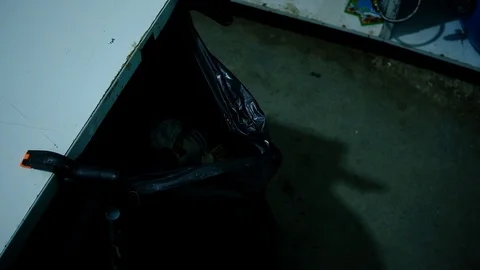 Young guy throws garbage into a bag Stock Footage 127288916