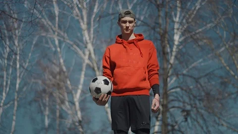 A young guy throws a soccer ball with his feet. Street football. Slow motion, 4K Stock Footage 114132833