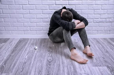 A young guy is trying to commit suicide. The guy is trying to give up drugs.  Stock Photos