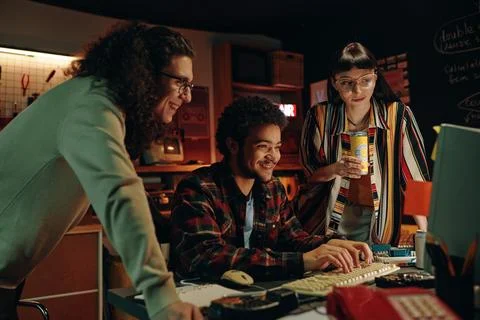 Young guy typing new codes for program Foto stock