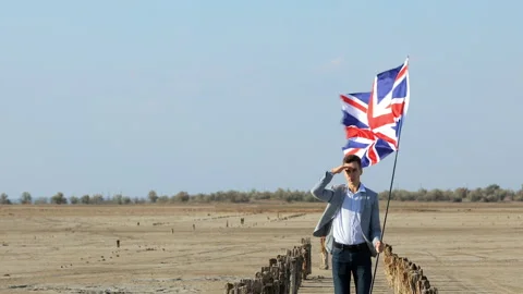 Young guy with the UK flag . Video stock 137950414