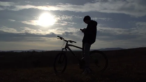 Young guy uses his smartphone to get his own route for further walks Stock Footage 122237160