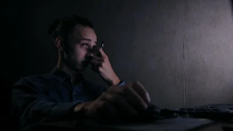 Young guy vaping in front of computer at home in dark room Video stock 99051233
