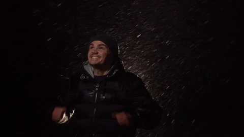 Young guy is very happy about the snowfall. Festive mood Stock Footage 122442533