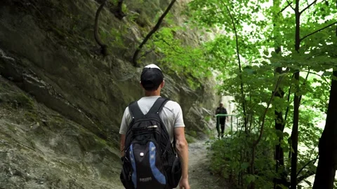 A young guy is walking along a mountain path in Matka Canyon Stock Footage 173505137