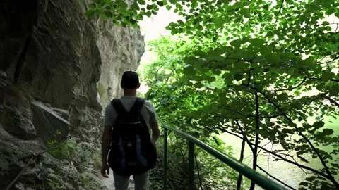 A young guy is walking along a mountain path in Matka Canyon Video stock 174653526