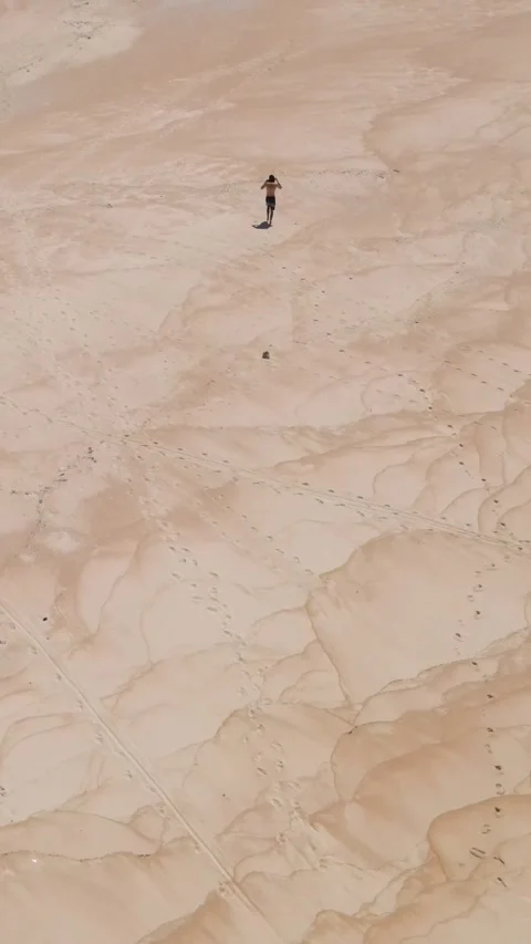 Young guy walking on the beach.Vertical video Stock Footage 300659344