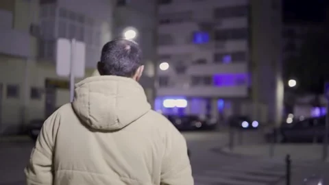 Young Guy Walking at night Stock Footage 169535570