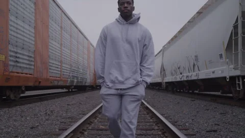 Young Guy Walks On Train Tracks In Sweatsuit Stock Footage 270325773