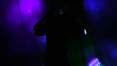 Young guy wave hands in front of display. Man watches and using VR-helmet virtua Stock Footage 130180214