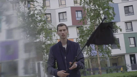 Young guy waving a black flag Stockbeeldmateriaal 156002144