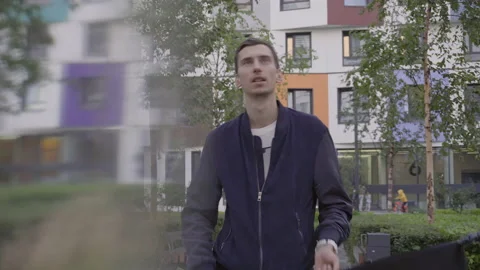 Young guy waving a black flag Stock-Footage 156002200