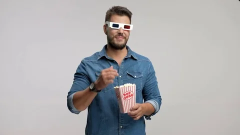 Young guy wearing pair of 3D glasses and laughing Video stock 77297876