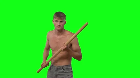 Young guy without t-shirt threatens with stick.modern neanderthal.green screen Stock-Footage 239661845