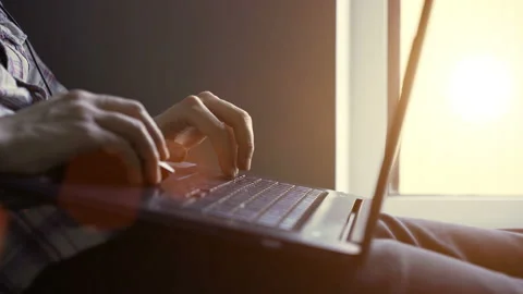 Young guy working at the computer at home. close-up Stock Footage 104553087