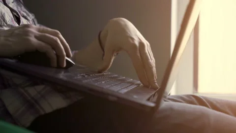 Young guy working at the computer at home. close-up 動画素材 104553456